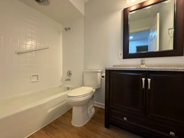 a bathroom with a toilet a sink and bathtub