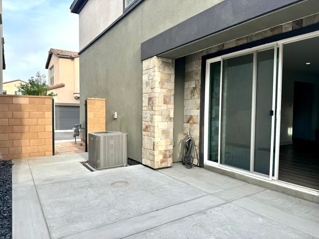 a front view of a house with a street