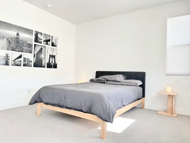 a bedroom with a bed and walk in closet