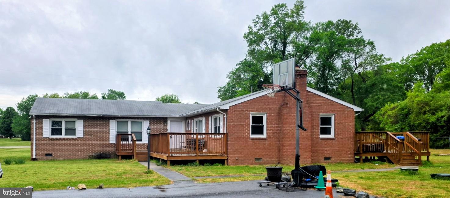 Charming brick home with spacious deck.