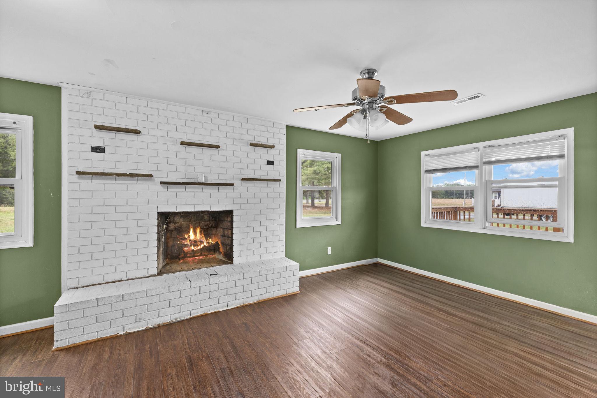 13245 Glen Level Drive Ruther Glen, VA 22546 - Photo 16 of 37 a living room with furniture and a fireplace
