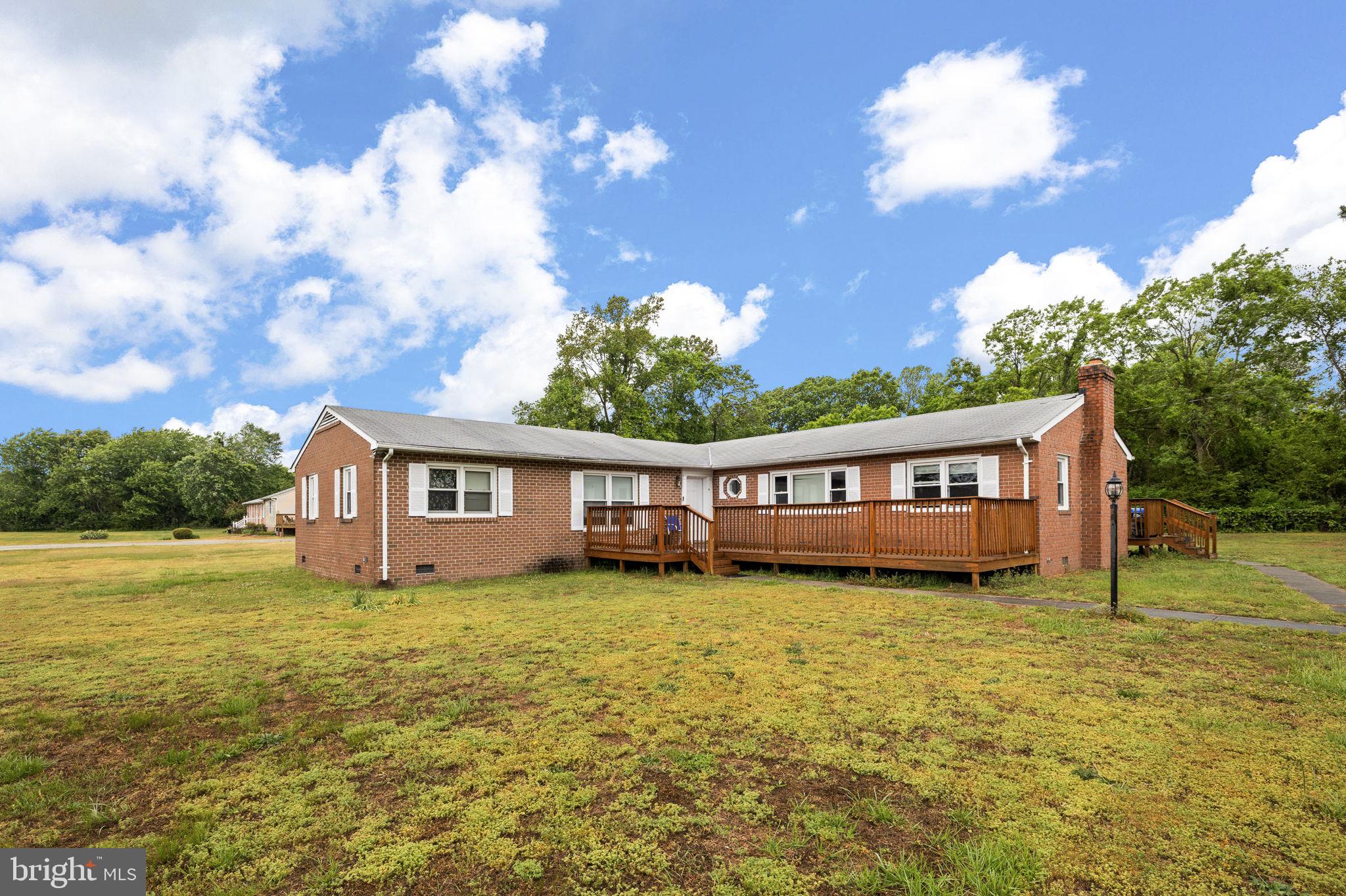 13245 Glen Level Drive Ruther Glen, VA 22546 - Photo 2 of 37 a view of a house with a big yard and a large tree