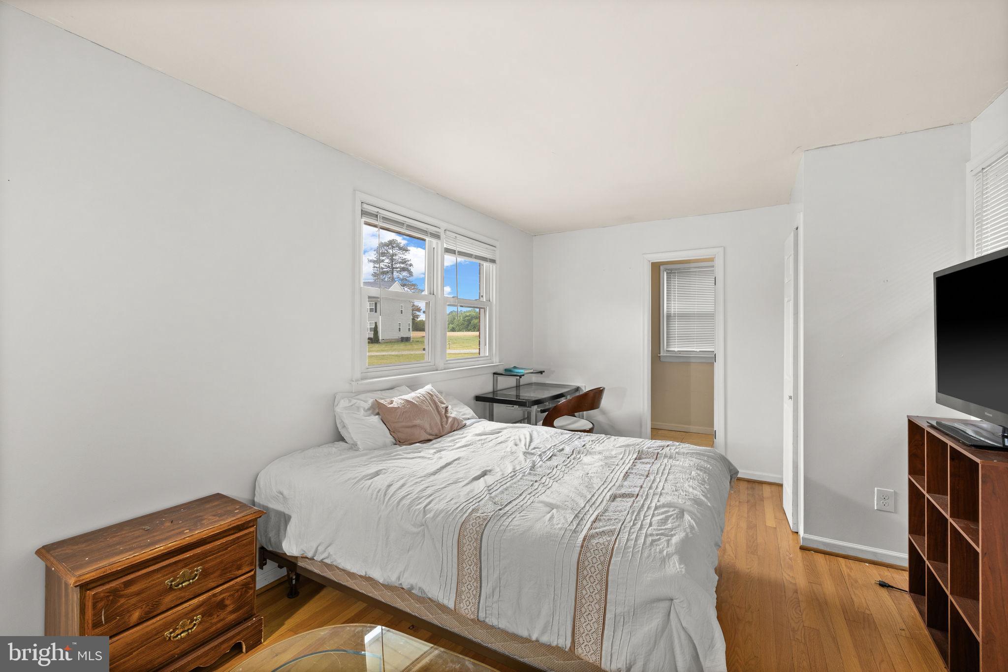 13245 Glen Level Drive Ruther Glen, VA 22546 - Photo 23 of 37 a bedroom with a bed and a flat screen tv