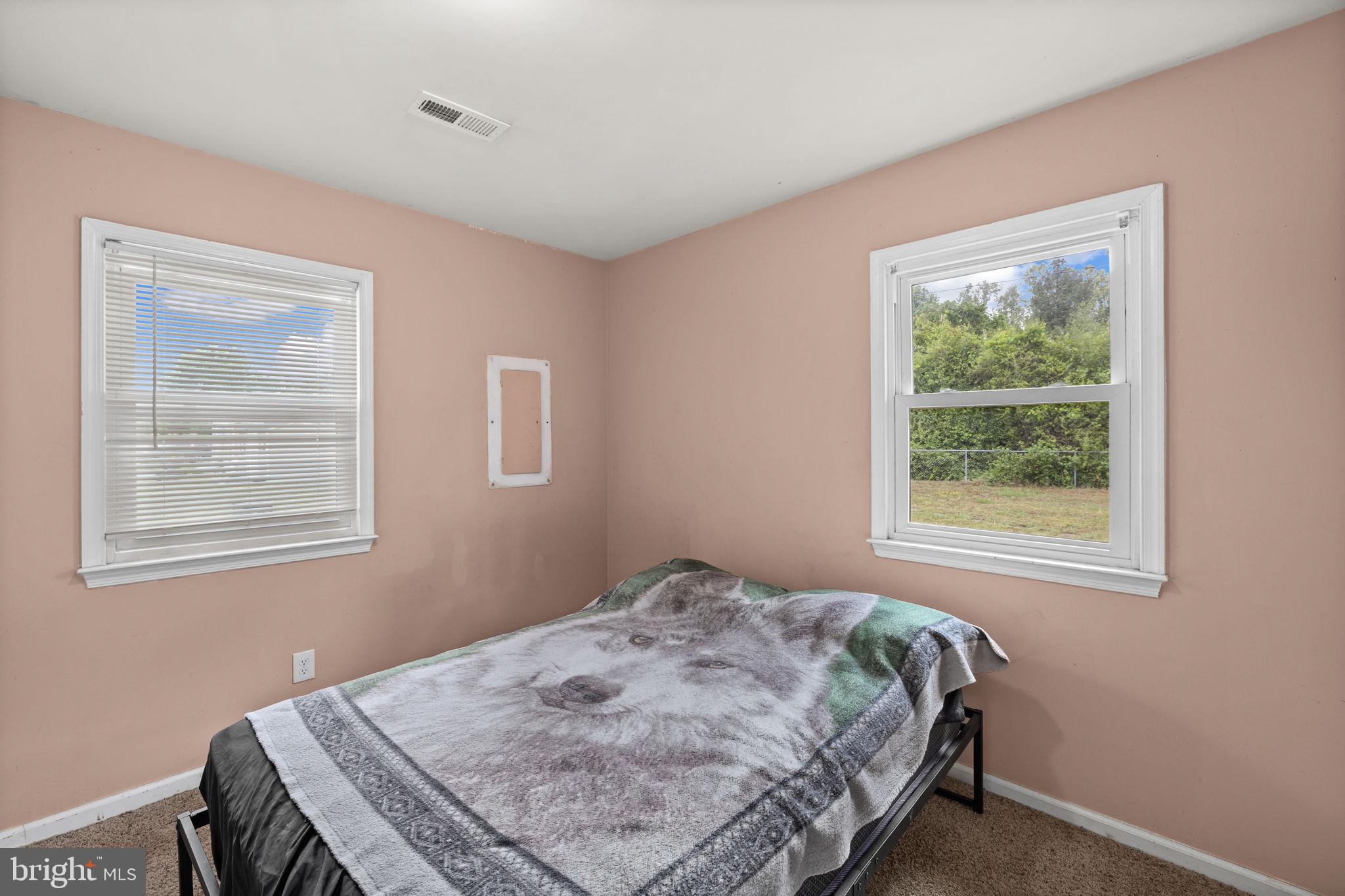 13245 Glen Level Drive Ruther Glen, VA 22546 - Photo 28 of 37 a bedroom with a bed and a window