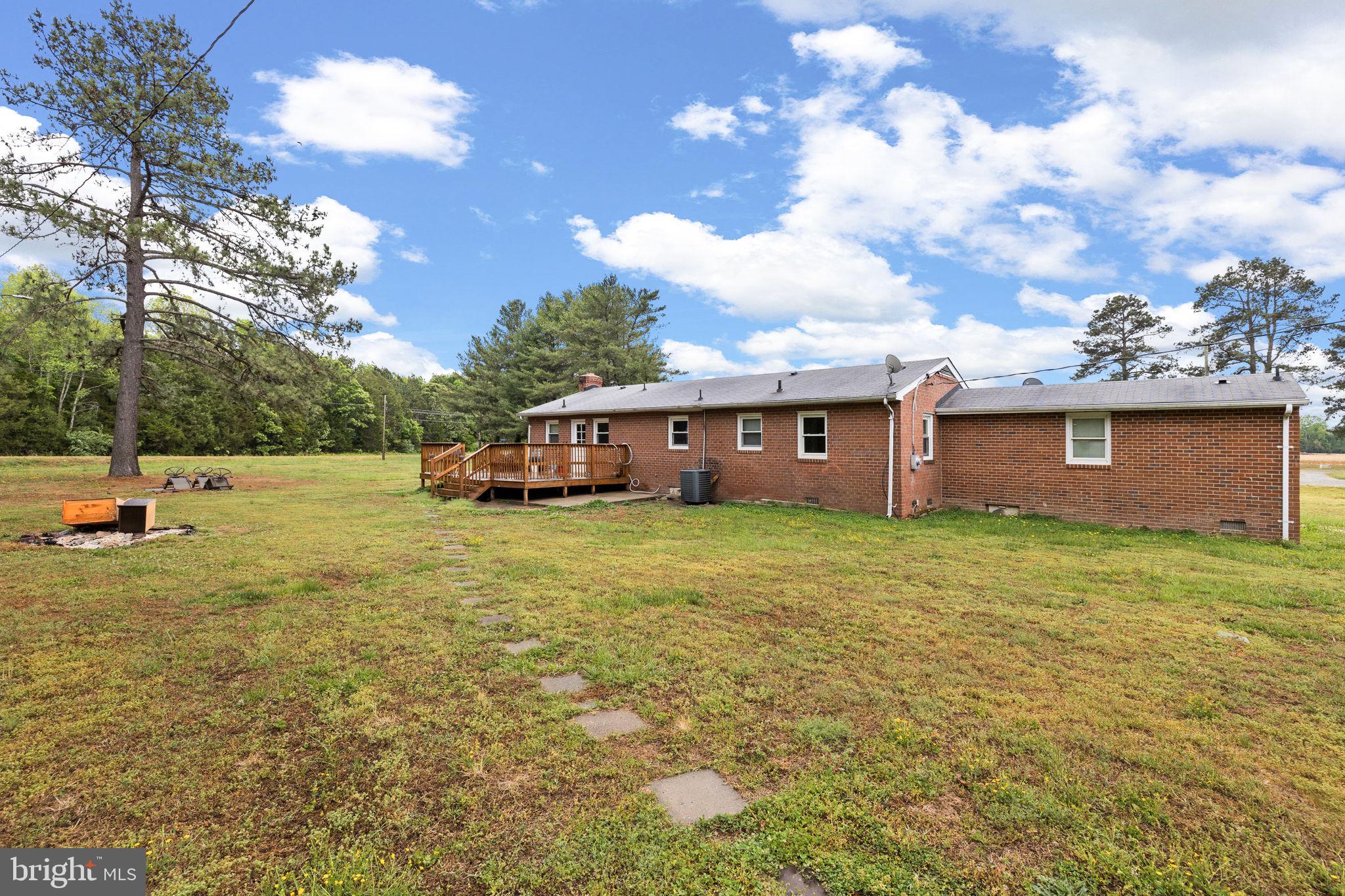 13245 Glen Level Drive Ruther Glen, VA 22546 - Photo 4 of 37 a view of a house with a yard