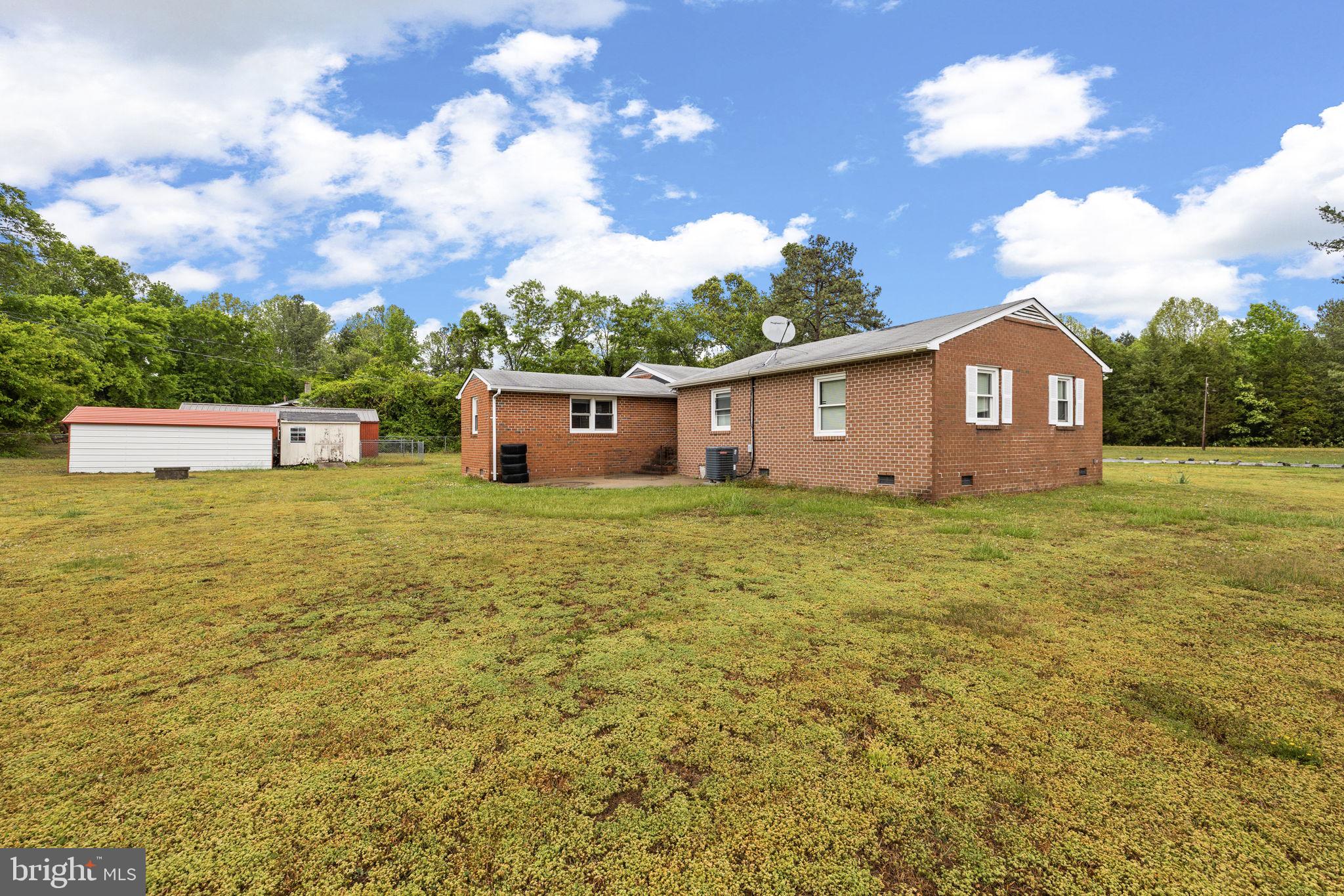 13245 Glen Level Drive Ruther Glen, VA 22546 - Photo 5 of 37 a view of a house with a yard