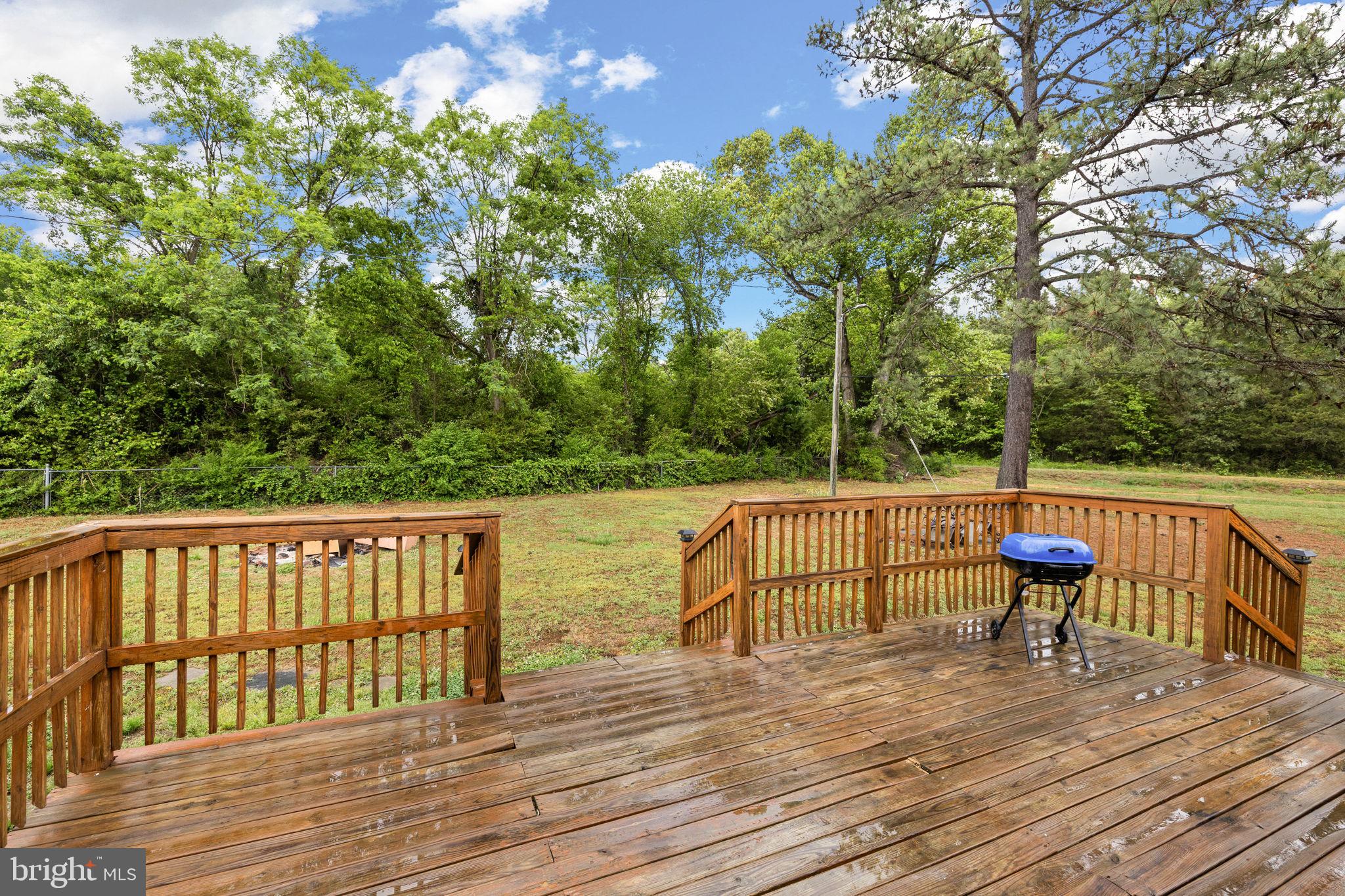 13245 Glen Level Drive Ruther Glen, VA 22546 - Photo 8 of 37 a view of deck with chairs and wooden floor