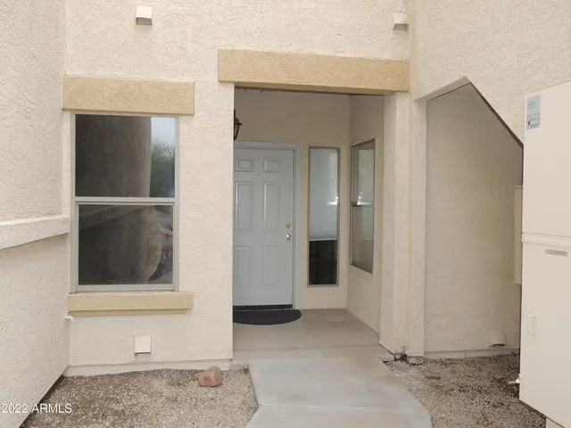 a view of entry way with wooden cabinet and cabinet
