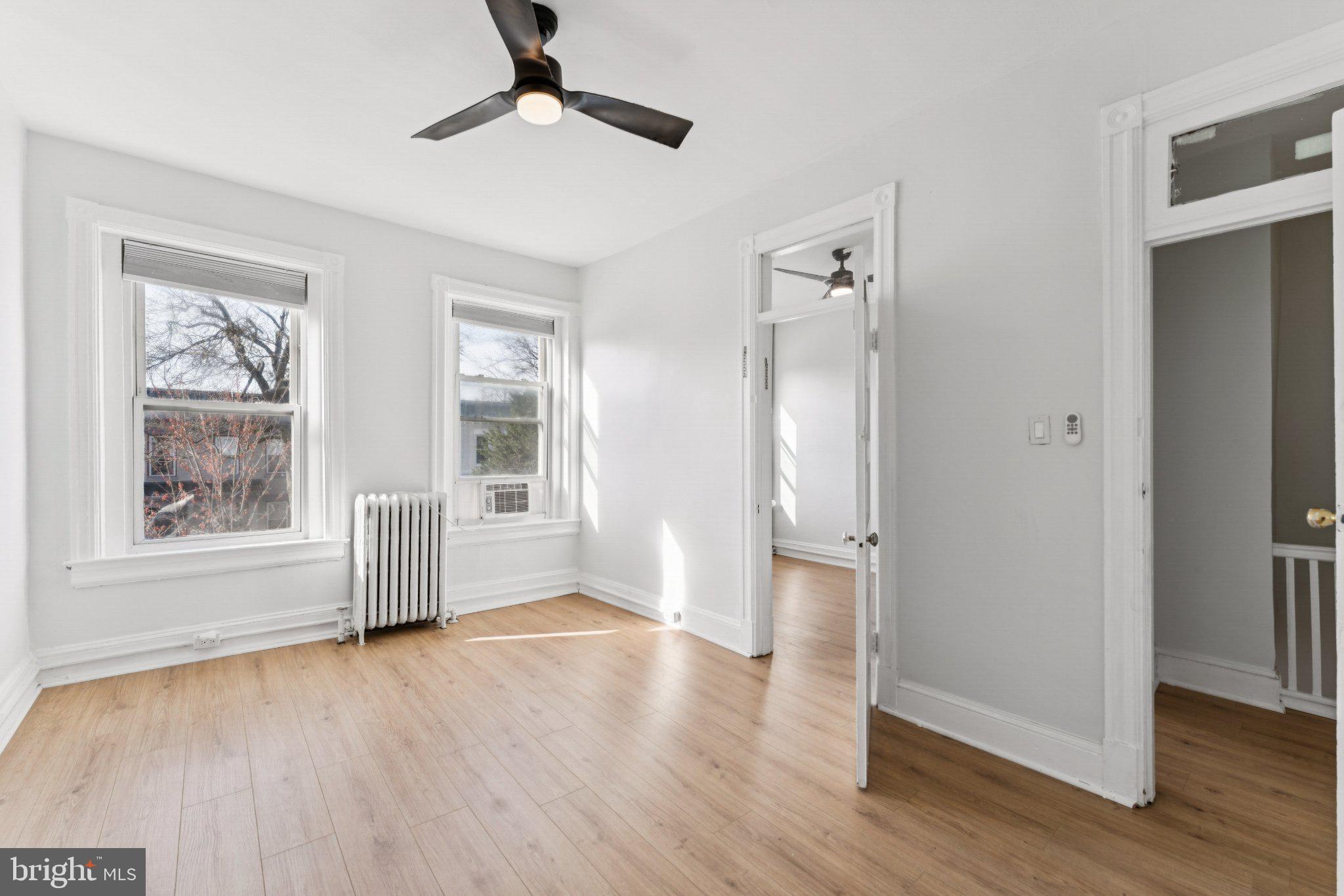 621 Kenyon Street Northwest Washington, DC 20010 - Photo 15 of 25 a view of empty room with wooden floor and fan