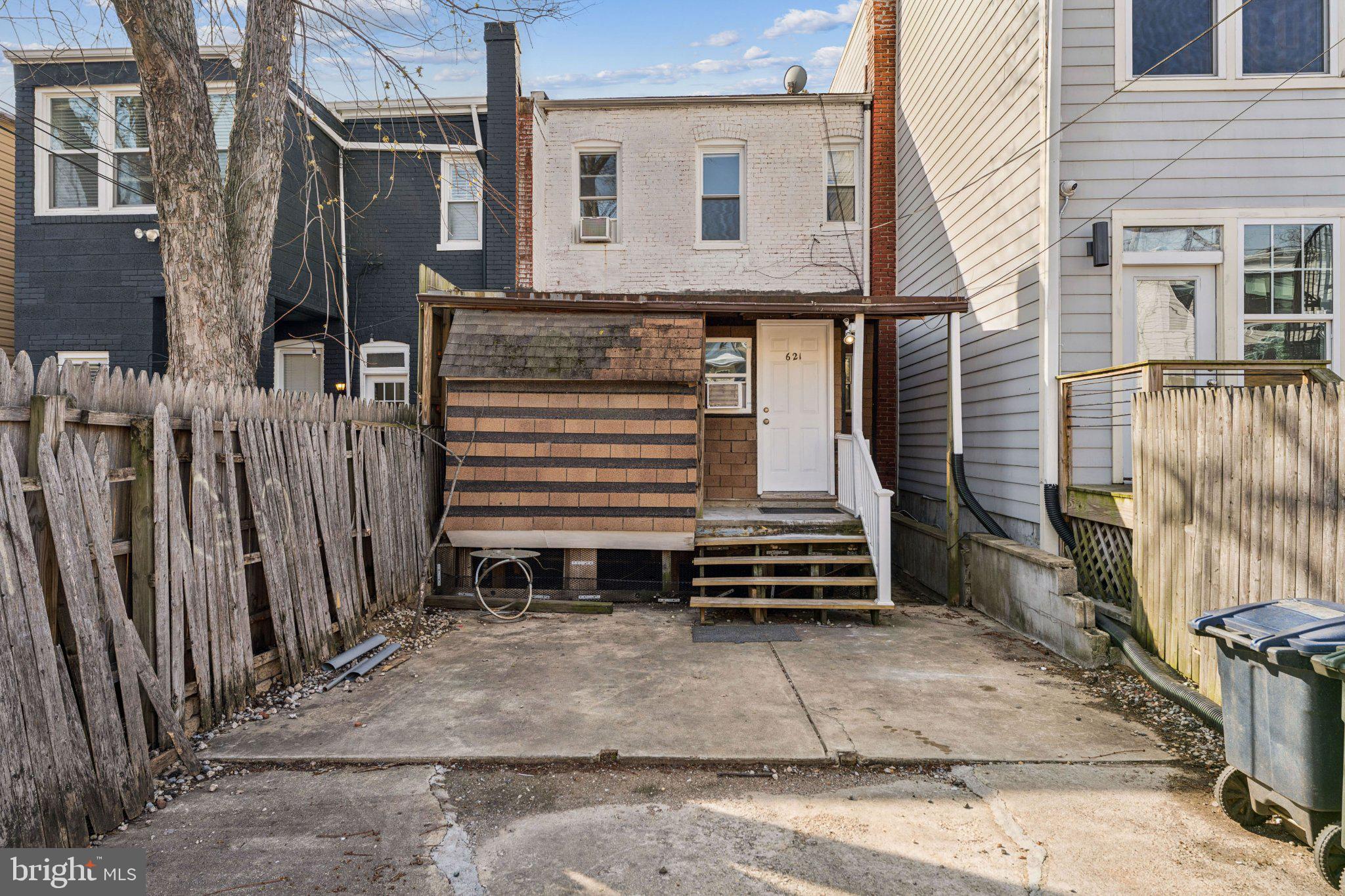 621 Kenyon Street Northwest Washington, DC 20010 - Photo 25 of 25 a view of a house with a door and wooden walls