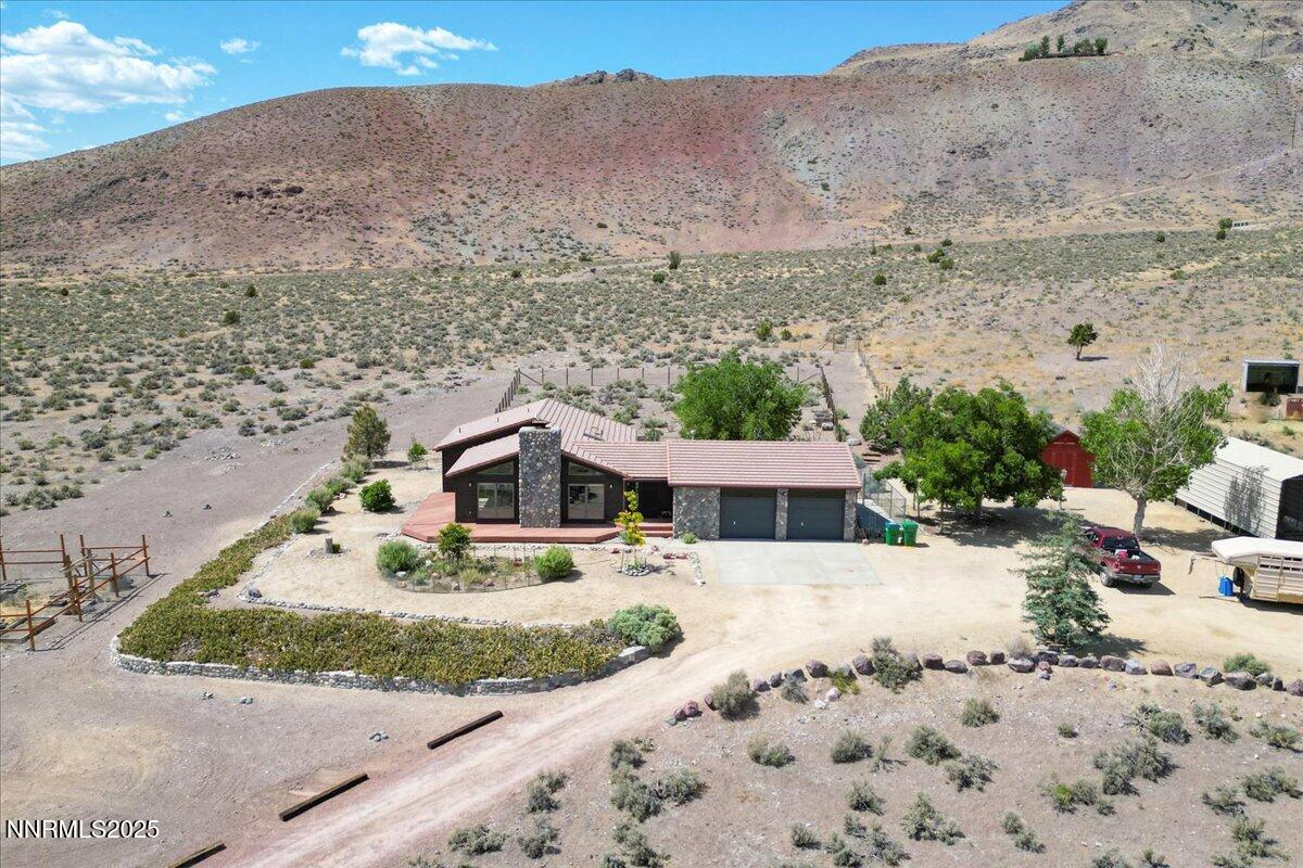 5455 Wild Horse Road Reno, NV 89510 - Photo 1 of 33 a view of a house with a yard covered in snow