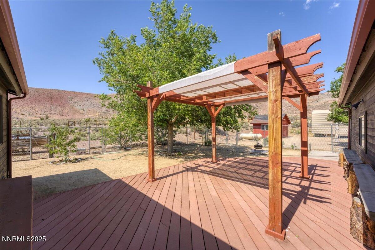 5455 Wild Horse Road Reno, NV 89510 - Photo 27 of 33 a porch with wooden floor table and chairs
