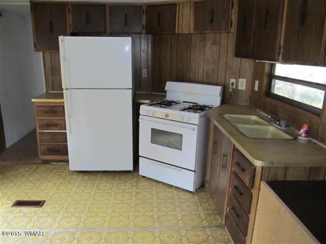 2866 Markham Road Overgaard, AZ 85933 - Photo 5 of 17 a utility room with dryer and washer