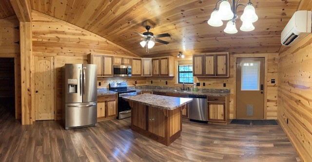 2570 North Old Bruceville Road Bruceville, TX 76630 - Photo 17 of 44 a kitchen with stainless steel appliances granite countertop a refrigerator a stove and a wooden floors