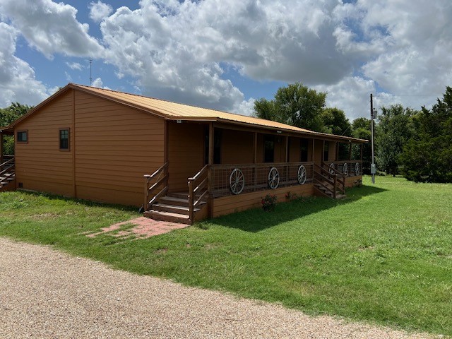 2570 North Old Bruceville Road Bruceville, TX 76630 - Photo 2 of 44 a backyard of a house with bicycles parked and swing