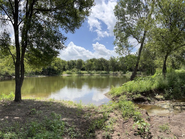 2570 North Old Bruceville Road Bruceville, TX 76630 - Photo 37 of 44 a view of a lake with houses in the back