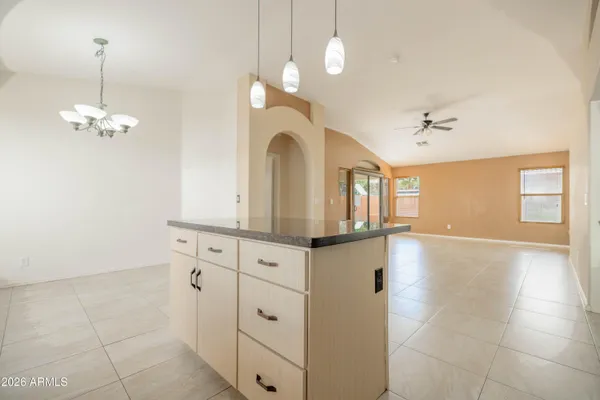 a large kitchen with cabinets and stainless steel appliances
