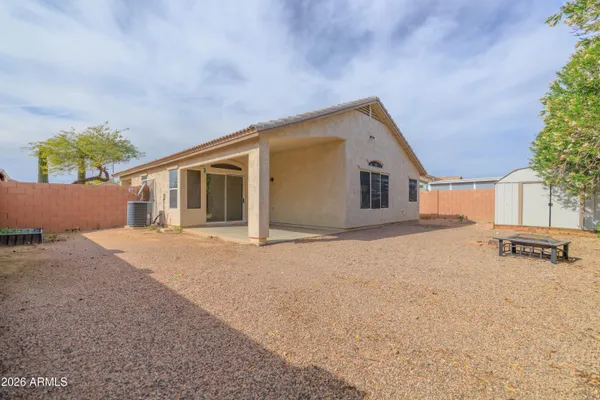 a view of a house with a backyard