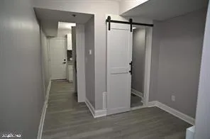 a view of a bathroom with wooden floor