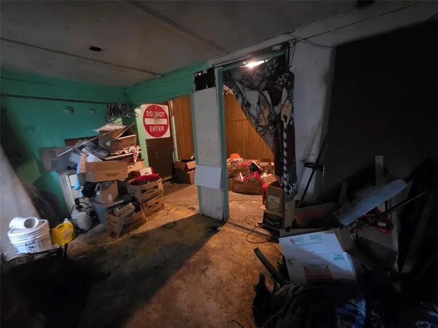 a bed room with a bed and a window