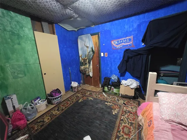 a bed room with a bed and a window