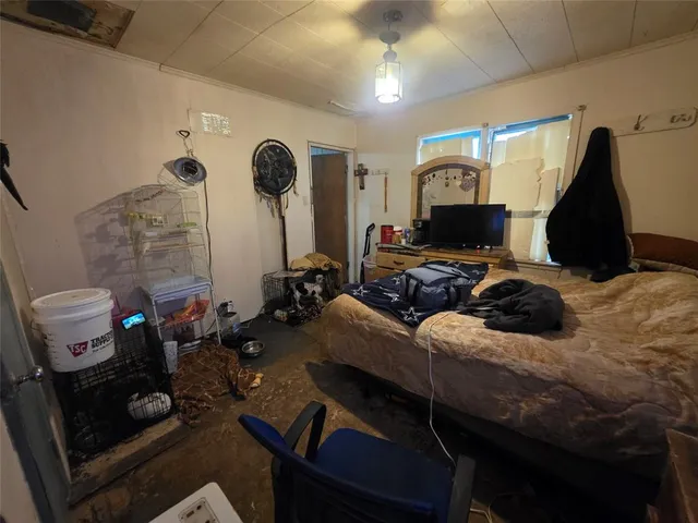 a view of a house with backyard and chairs