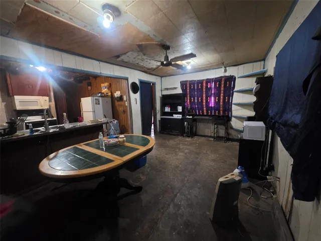 a kitchen with a sink appliances and cabinets