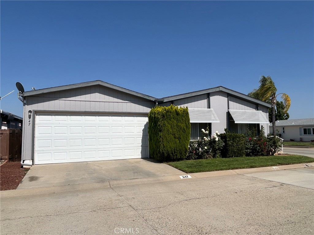 27250 Murrieta Road, Unit 347 Menifee, CA 92586 - Photo 6 of 39 a view of a house with a yard