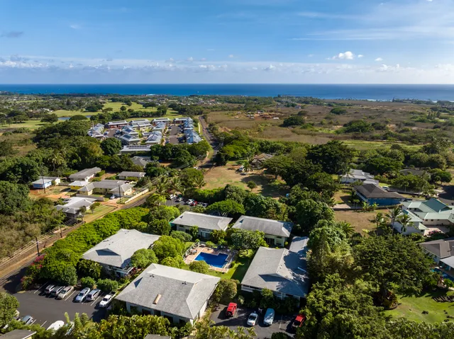 an aerial view of residential houses with outdoor space