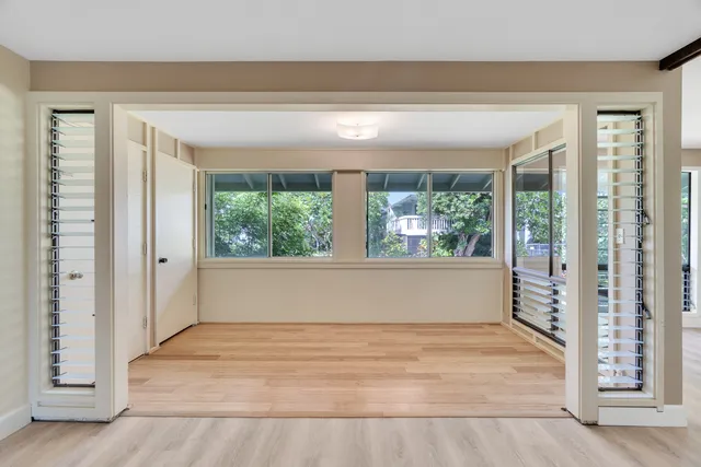 a view of an empty room with a window