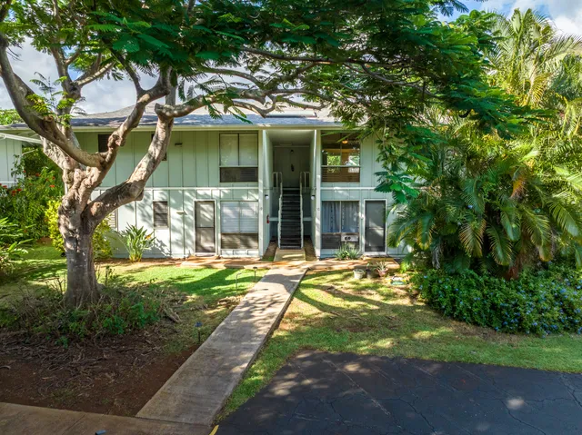 front view of a house with a yard