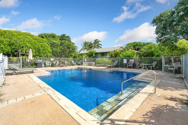 a view of a swimming pool with a patio