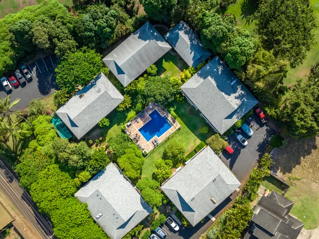 an aerial view of a house with swimming pool and outdoor space