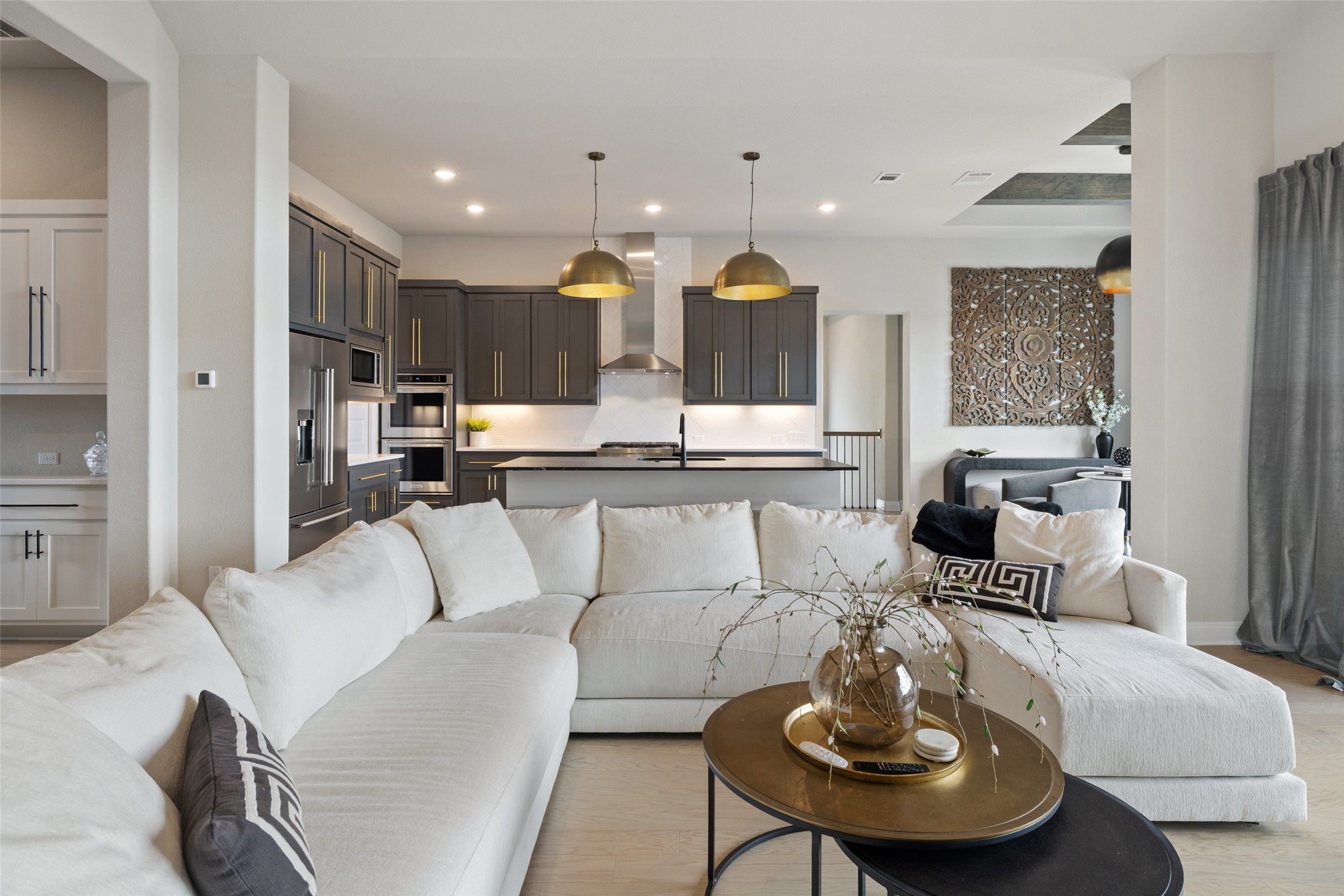 2220 Normandy View Leander, TX 78641 - Photo 15 of 40 a living room with stainless steel appliances kitchen island furniture and a view of kitchen