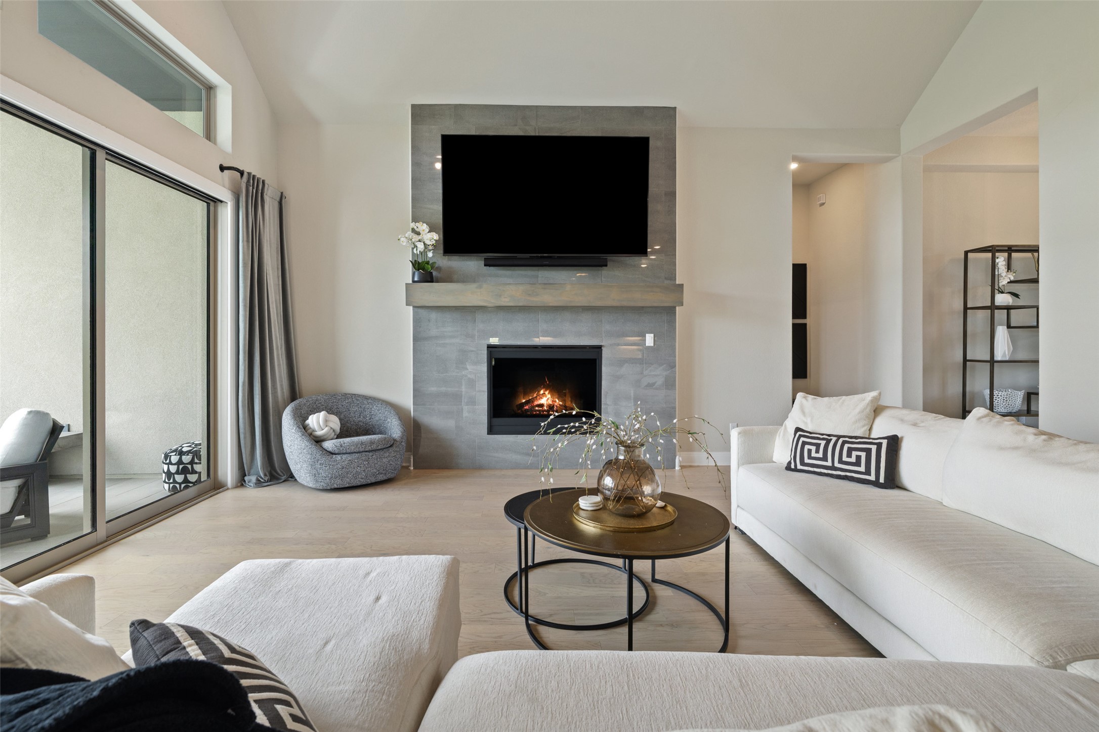 2220 Normandy View Leander, TX 78641 - Photo 16 of 40 a living room with furniture a fireplace and a flat screen tv