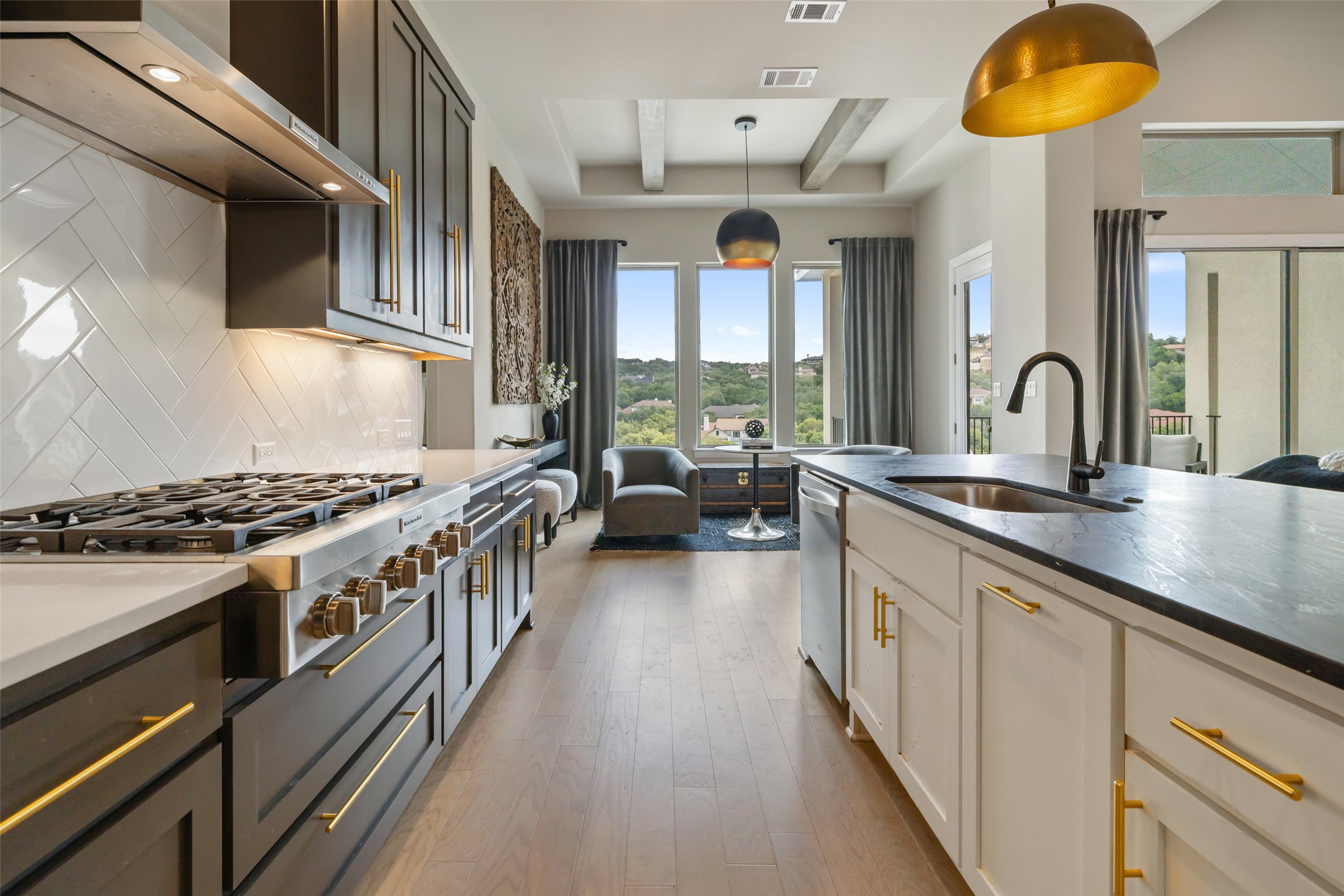 2220 Normandy View Leander, TX 78641 - Photo 20 of 40 a kitchen with stainless steel appliances granite countertop a stove and a sink