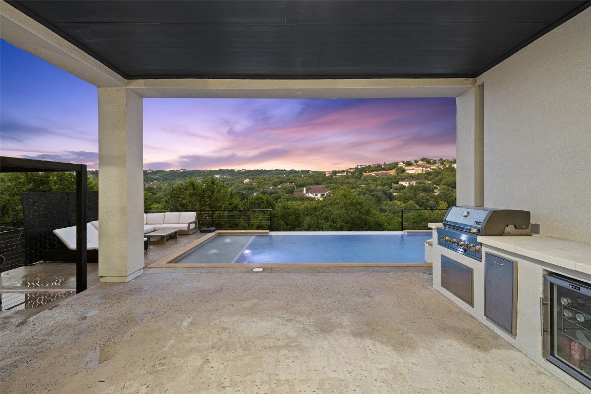 2220 Normandy View Leander, TX 78641 - Photo 27 of 40 Outdoor pool featuring area for grilling, a patio area, and an outdoor living space