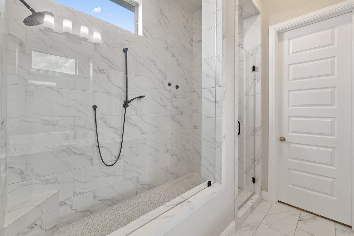 2220 Normandy View Leander, TX 78641 - Photo 28 of 40 Bathroom featuring a marble finish shower and light marble finish flooring