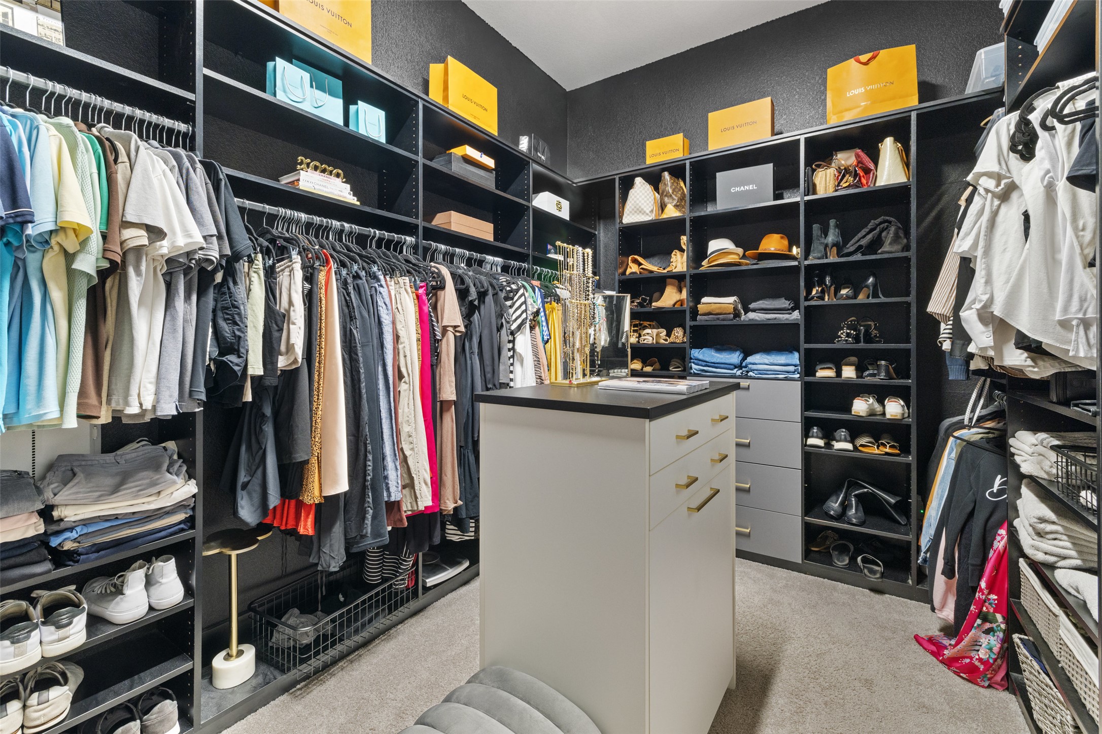 2220 Normandy View Leander, TX 78641 - Photo 29 of 40 a view of walk in closet with clothes and shoes