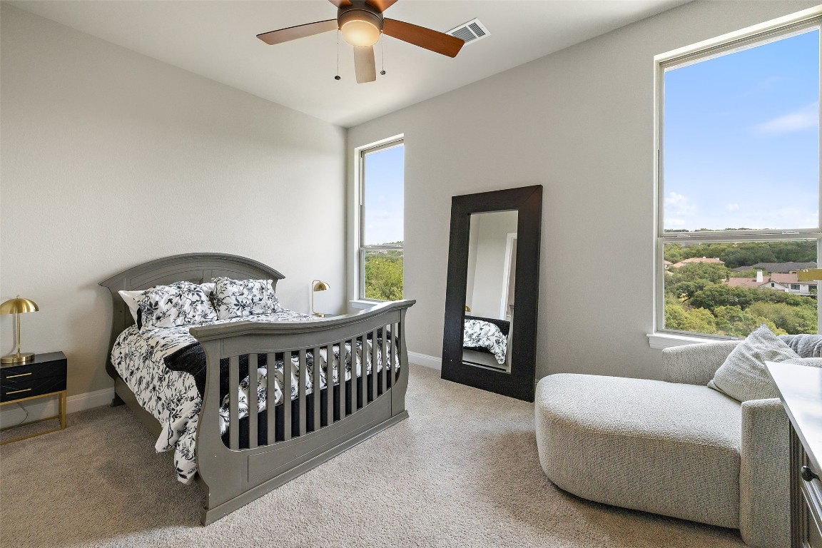 2220 Normandy View Leander, TX 78641 - Photo 31 of 40 Bedroom featuring light carpet and a ceiling fan