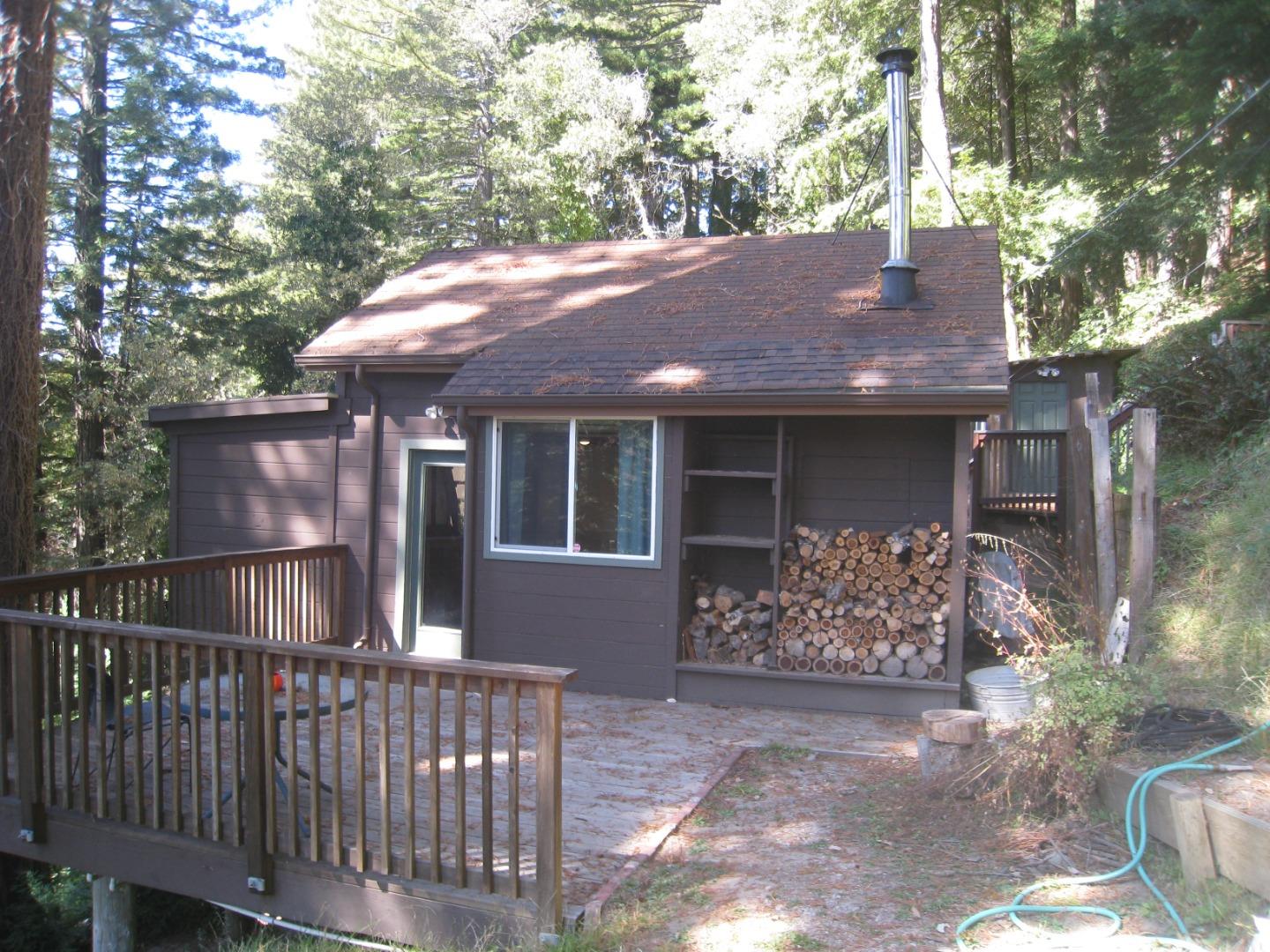 347 Ridge Road Woodside, CA 94062 - Photo 1 of 20 a front view of house with yard and trees in the background