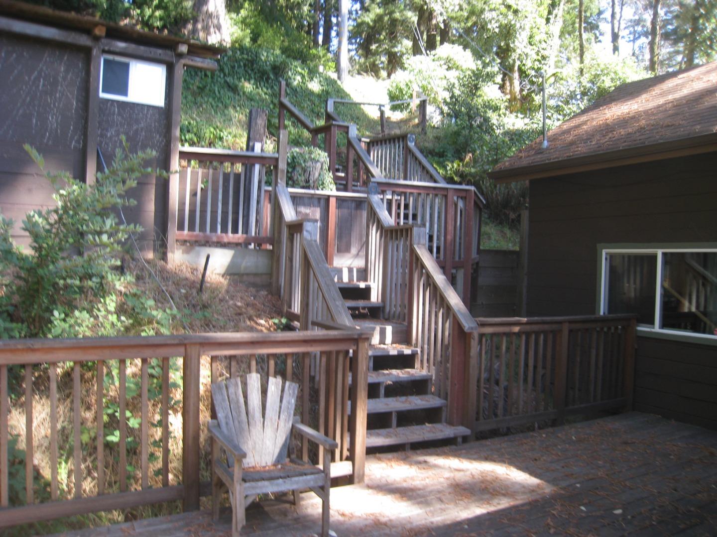 347 Ridge Road Woodside, CA 94062 - Photo 6 of 20 a view of balcony with wooden floor and fence