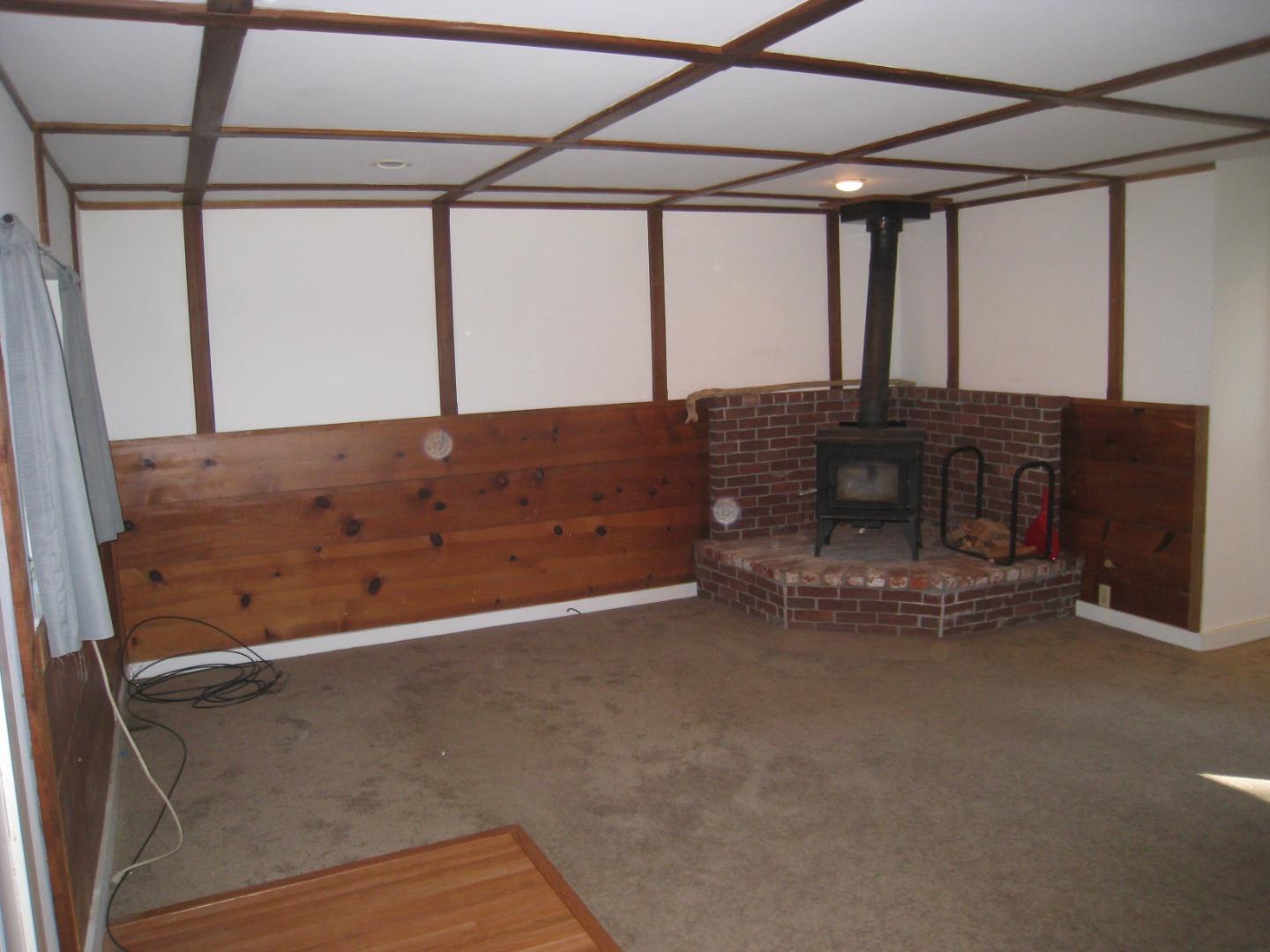 347 Ridge Road Woodside, CA 94062 - Photo 7 of 20 a room with a fireplace