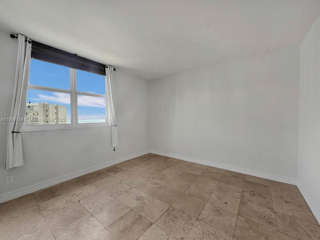 2475 Brickell Avenue, Unit 2006 Miami, FL 33129 - Photo 18 of 61 an empty room with a window