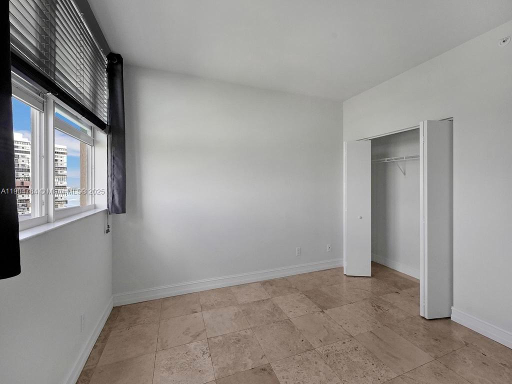 2475 Brickell Avenue, Unit 2006 Miami, FL 33129 - Photo 19 of 61 a view of an empty room with a window