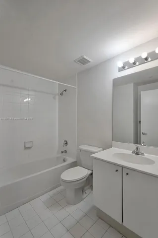 a lobby with furniture and floor to ceiling window