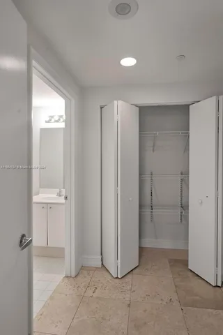 a view of a room with gym equipment and a large window