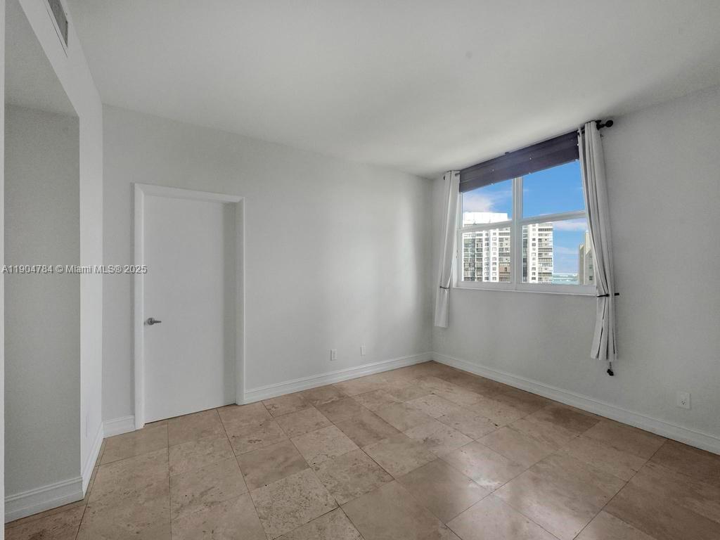 2475 Brickell Avenue, Unit 2006 Miami, FL 33129 - Photo 25 of 61 a view of an empty room with a window