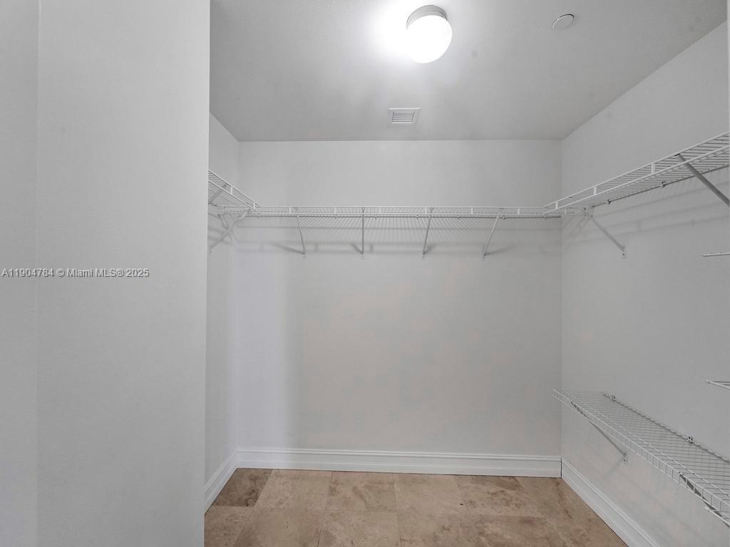 2475 Brickell Avenue, Unit 2006 Miami, FL 33129 - Photo 31 of 61 a view of a room with racks on the wall