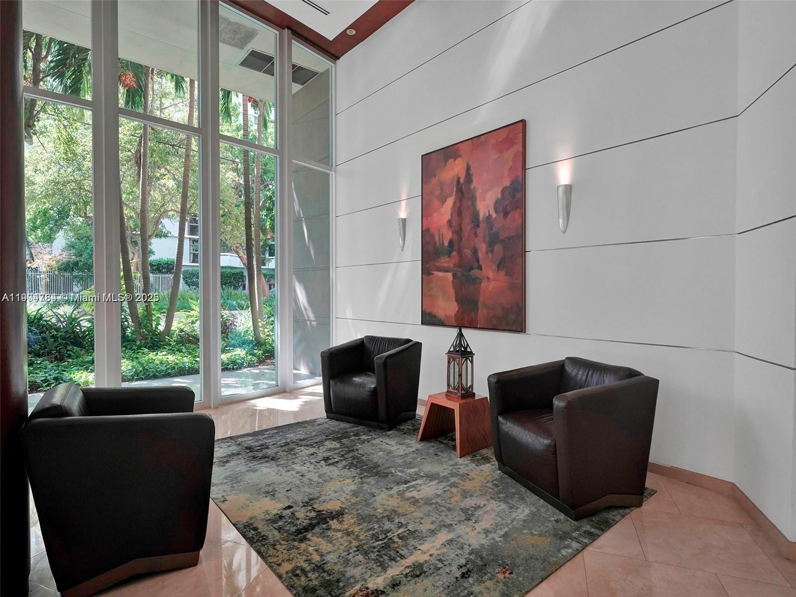 2475 Brickell Avenue, Unit 2006 Miami, FL 33129 - Photo 40 of 61 a living room with furniture and a floor to ceiling window